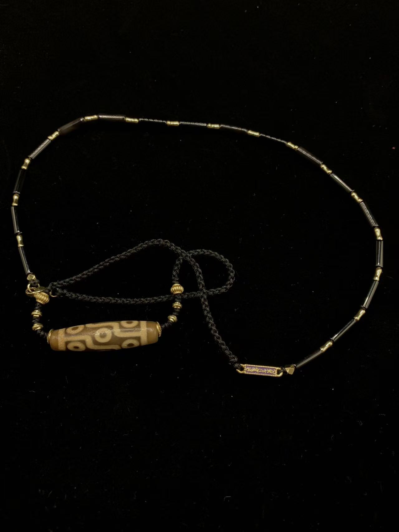 "The Sovereign Nine" Necklace - Ancient Nine-Eyed Dzi Bead with Black Agate & Signature Purple Enamel Badge